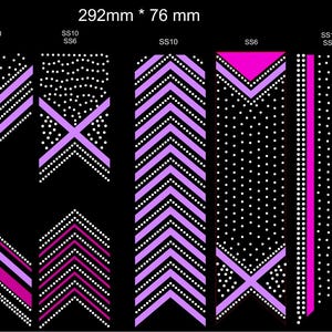 May include: A set of eight rhinestone designs in pink and purple on a black background. The designs include a curved line, diagonal lines, a chevron pattern, a solid line, a cross, and a swirl. The designs are approximately 292 mm by 76 mm.