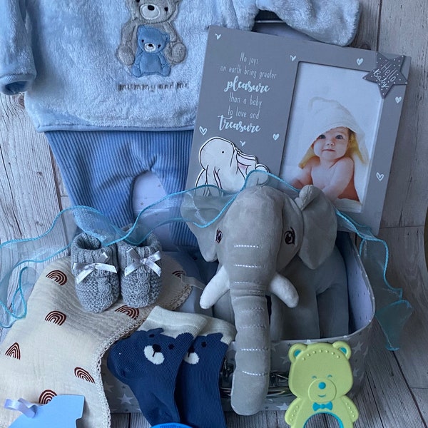 A lovely baby hamper available for  boy in a grey suitcase