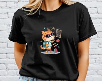 May include: Black t-shirt featuring a cartoon cat wearing sunglasses and a backpack, holding a pencil and standing in front of a chalkboard. The chalkboard has the text "12-01 & KES". An apple, books, and pencils are also shown.