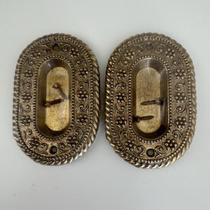 May include: A set of three ceramic mugs with a speckled, matte finish. The mugs are in shades of cream, light gray, and dark gray. Each mug has a simple, minimalist design, perfect for coffee or tea.