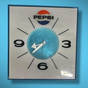 Reloj de pared vintage de Pepsi, años 60 y 70, con letrero luminoso de neón, decoración atómica de mediados de siglo.