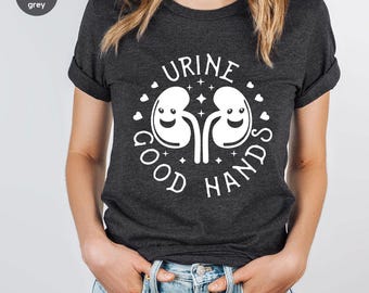 Camiseta "Buenas Manos con Orina", Camiseta con un Lindo Juego de Palabras sobre Riñones, Camiseta con Humor Médico, Regalo para Enfermeras, Camiseta con Chiste sobre Riñones, Ropa con Juego de Palabras sobre Anatomía, Enfermera de Nefrología