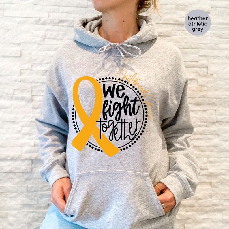 May include: Heather grey hoodie with a yellow ribbon and the text "We fight together" in a black circle.