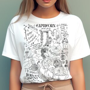 May include: White t-shirt with a black and white illustration of a Capricorn zodiac sign. The illustration includes the text "Capricorn", "Dec 22 - Jan 19", "Creative", "Loyal", "Vintage", "Loving", "Ambitious", "Disciplined", "Destined to Succeed", "Born to Ascent", and "Focus".