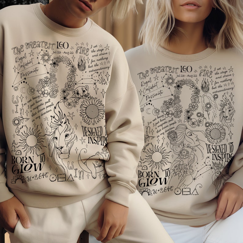 Peut inclure: Sweat-shirt beige avec un motif graphique noir repr&eacute;sentant un lion, des fleurs et du texte. Le texte comprend "The Greatest Leo", "Born to Glow" et "Designed to Inspire". Le motif comprend &eacute;galement des symboles astrologiques et les dates du 23 juillet au 22 ao&ucirc;t.