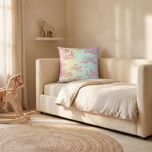 May include: A bedroom scene with a bed and a decorative pillow with a pastel design. A wooden rocking horse and a stuffed horse in a basket are also visible. A round rug is on the floor. The room is bathed in natural light.