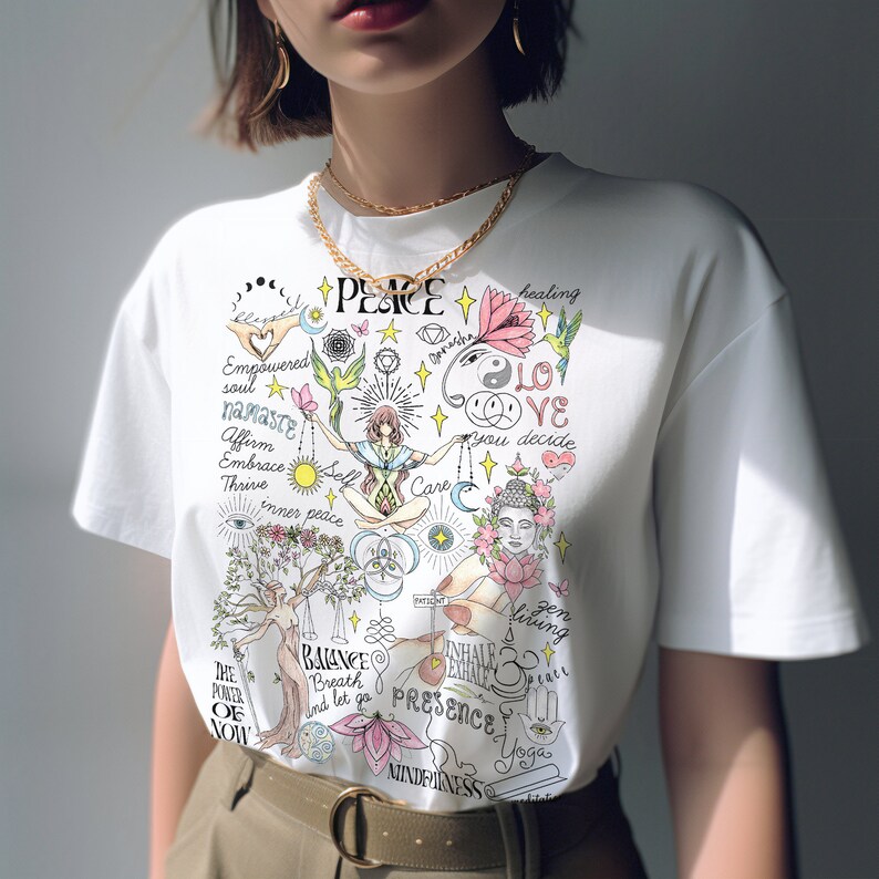 May include: White t-shirt with a colorful graphic design featuring words like "peace", "love", "namaste", "inner peace", "balance", "presence", and "mindfulness".