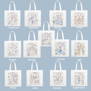 Peut inclure: Douze sacs cabas blancs avec des signes du zodiaque et des illustrations color&eacute;s. Chaque sac pr&eacute;sente un signe du zodiaque diff&eacute;rent, notamment Capricorne, Verseau, Poissons, B&eacute;lier, Taureau, G&eacute;meaux, Cancer, Lion, Vierge, Balance, Scorpion et Sagittaire.
