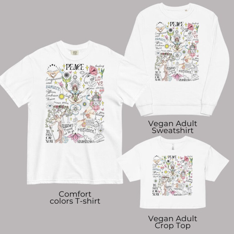 May include: Three white t-shirts with a colorful graphic print of a tree with flowers and the word "PEACE" in the center. The graphic also includes the words "balance", "presence", "mindfulness", "love", "embrace", "affirm", "namaste", "thrive", "the power of now", and "healing". The t-shirts are labeled "Comfort colors T-shirt", "Vegan Adult Sweatshirt", and "Vegan Adult Crop Top".