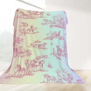 May include: A large, draped fabric with a pastel gradient background of yellow, green, and blue. The fabric features a repeating pink toile pattern of unicorns, riders, and landscapes. The overall theme is fantasy and whimsy.