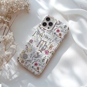 May include: A white phone case with a colorful design featuring the zodiac sign Virgo, flowers, and the text "Blessed to Succeed".