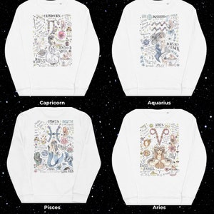 Peut inclure: Quatre sweat-shirts blancs avec diff&eacute;rents signes du zodiaque imprim&eacute;s sur le devant. Chaque sweat-shirt pr&eacute;sente un signe du zodiaque diff&eacute;rent avec une illustration d&eacute;taill&eacute;e et du texte. Les signes du zodiaque sont le Capricorne, le Verseau, les Poissons et le B&eacute;lier.