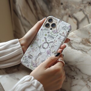 May include: White iPhone case with a colorful design featuring a zodiac sign, stars, and the words "Born to Thrive" and "Comfort Zone".