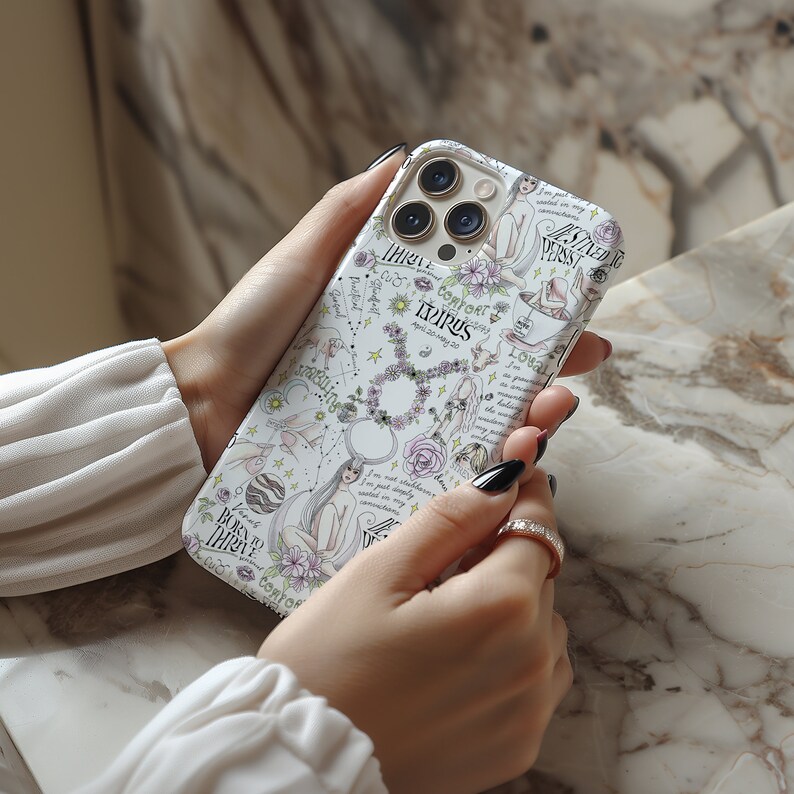 May include: White iPhone case with a colorful design featuring a zodiac sign, stars, and the words "Born to Thrive" and "Comfort Zone".