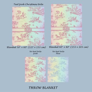 May include: Pink throw blankets with a Christmas toile pattern, depicting horses and riders. One blanket is 127 x 153 cm, the other is 153 x 203 cm. Each features a personalized name banner. The text reads "THROW BLANKET".