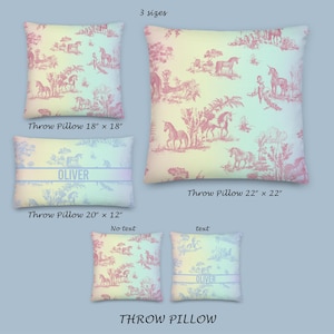 May include: Cushions in three sizes, with a pink and white toile design depicting unicorns and rural scenes. The cushions measure 45.7 x 45.7 cm, 50.8 x 30.5 cm, and 55.9 x 55.9 cm. One cushion has the name "OLIVER" printed on it.