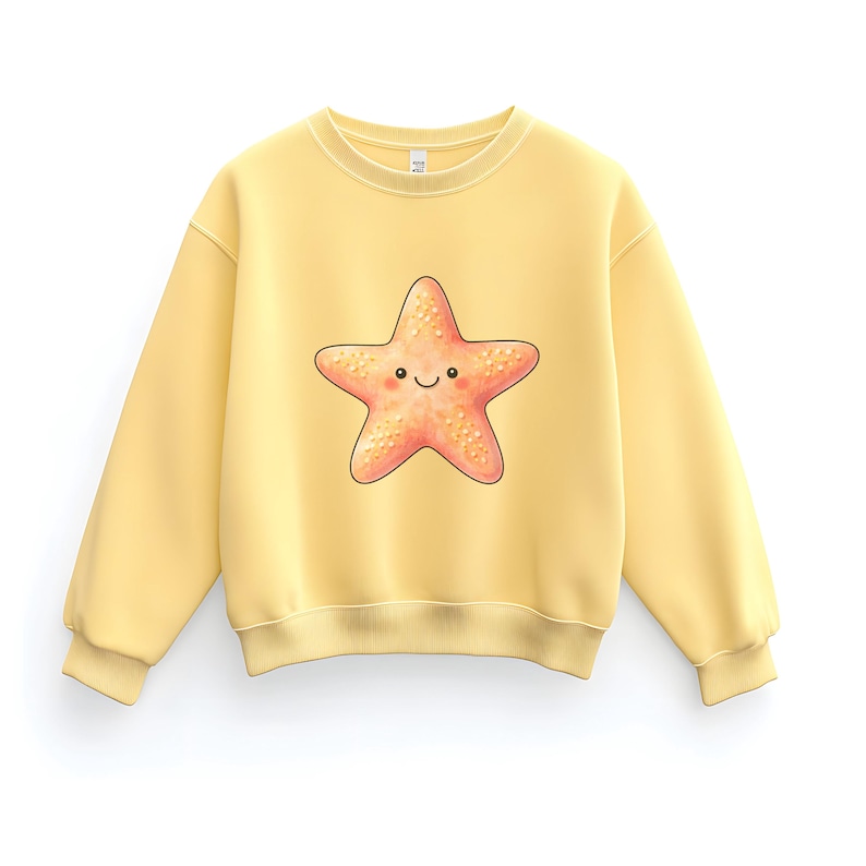 May include: A light yellow sweatshirt featuring a smiling starfish graphic. The starfish is a warm coral color with a textured appearance. The sweatshirt has a crew neck and long sleeves, perfect for casual wear.