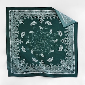 May include: A green bandana with a white floral pattern and a paisley border.