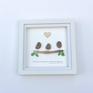 May include: A set of three ceramic mugs with a speckled, matte finish. The mugs are in cream, light grey, and dark grey. Each mug has a simple, minimalist design, ideal for coffee or tea.