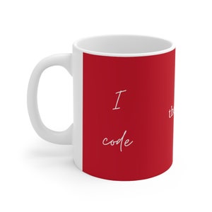 May include: White ceramic mug with a red panel displaying the text "I code, therefore I am". The mug has a curved handle and a glossy finish, ideal for tea or coffee.