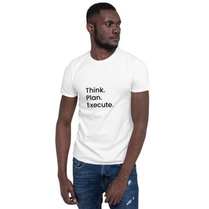 May include: White t-shirt with the text "Think. Plan. Execute." printed in black.