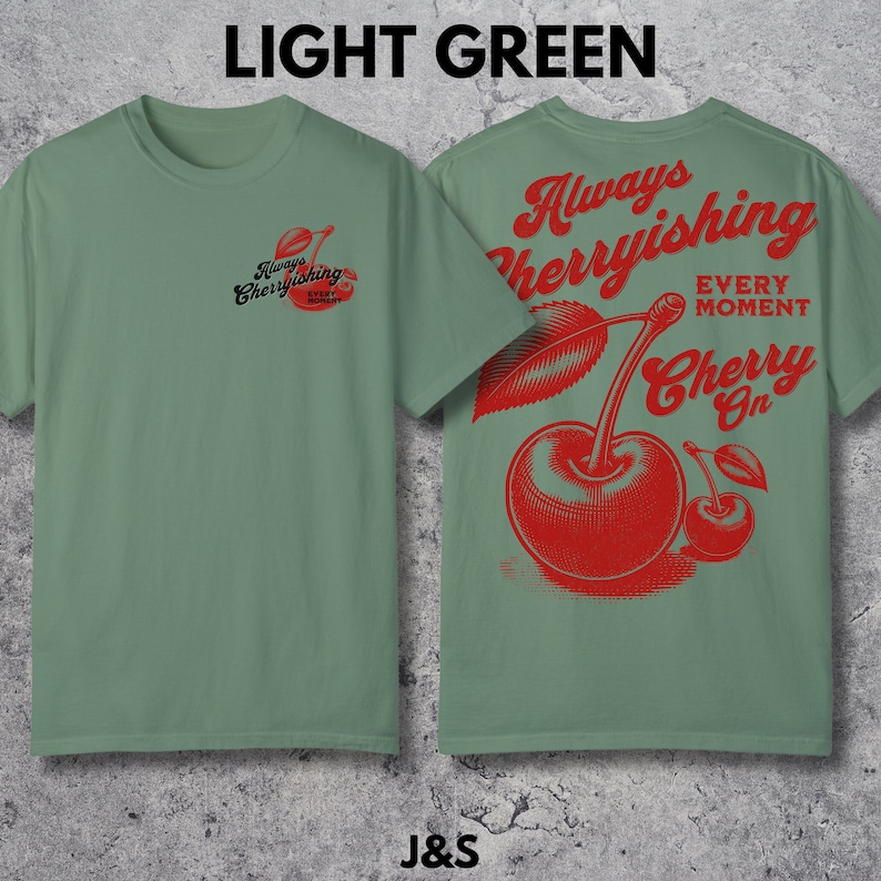 May include: Light green t-shirt with a red cherry graphic and the text "Always Cherryishing Every Moment Cherry On".
