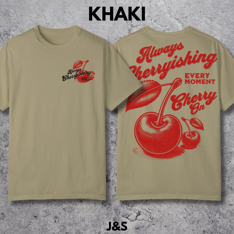 May include: Khaki t-shirt with a red cherry graphic and the text "Always Cherryishing Every Moment Cherry On".