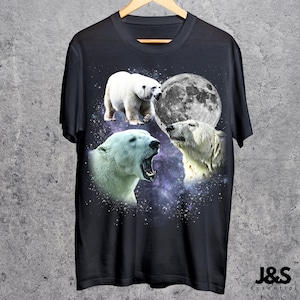 May include: Black t-shirt featuring a design of three polar bears, a full moon, and a starry galaxy background. The bears are in different poses, with one roaring. The text "J&S Essential" is at the bottom.