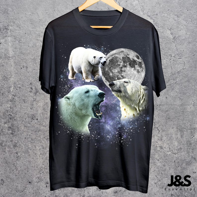 May include: Black t-shirt featuring a design of three polar bears, a full moon, and a starry galaxy background. The bears are in different poses, with one roaring. The text "J&S Essential" is at the bottom.