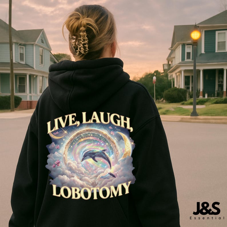 May include: Black hoodie with the words "LIVE, LAUGH, LOBOTOMY" in white and a colorful graphic of a dolphin jumping through a rainbow. The hoodie has a drawstring hood and a kangaroo pocket.