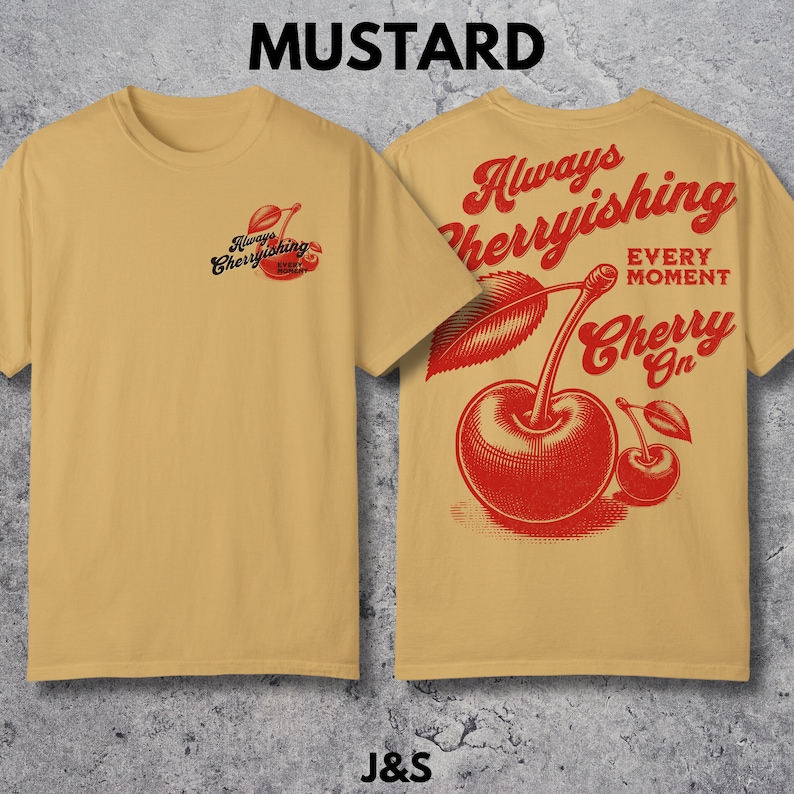 May include: Mustard yellow t-shirt with a red cherry graphic and the text "Always Cherryishing Every Moment Cherry On".