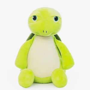 May include: A soft, green turtle toy with a light green belly, dark green details, and large eyes. The plush toy is designed to be cuddly and is suitable for children or as a decorative item.