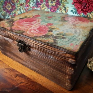 Old wooden box with flower