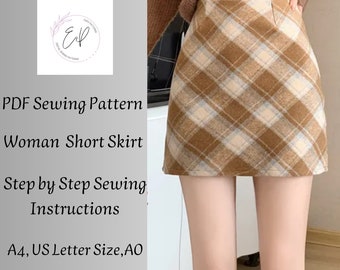 May include: A PDF sewing pattern for a short skirt with a brown and white plaid design. The pattern includes step-by-step instructions and is available in A4, US Letter, and AO sizes.