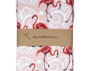 May include: A set of two pink tea towels with a white damask pattern and pink flamingos. The towels are folded and have a brown label with the text "OLDEHALL".