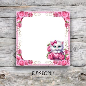 May include: A pink square notepad featuring a floral border and a kitten illustration. The kitten, with a pink bow, is in a polka-dot teacup surrounded by pink roses. The words "DESIGN 1" are at the bottom.