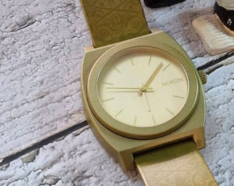 Special Nixon watches, 14K 100 micron gold insert colour, very light weight watch form polycabonate, nice condition