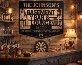 May include: Black metal sign for a basement bar, with the text "THE JOHNSON'S BASEMENT BAR & LOUNGE" and "Est. 2020". The sign includes illustrations of bar-related items. The sign is mounted on a wooden wall, with a bar and stools in the foreground.