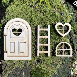 May include: DIY kit for a fairy door, featuring a wooden door with a heart-shaped window, a ladder, a heart-shaped window, and a square window.