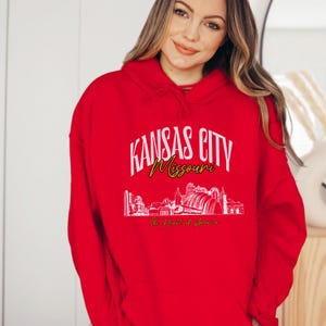 Retro oversized Kansas City skyline Hoodie with vintage cityscape design. Unisex hooded sweatshirt perfect for Kansas City fans and Missouri State lovers. Unique varsity-style Kansas City fan shirt with bold city skyline graphic.