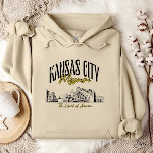 Retro oversized Kansas City skyline Hoodie with vintage cityscape design. Unisex hooded sweatshirt perfect for Kansas City fans and Missouri State lovers. Unique varsity-style Kansas City fan shirt with bold city skyline graphic.