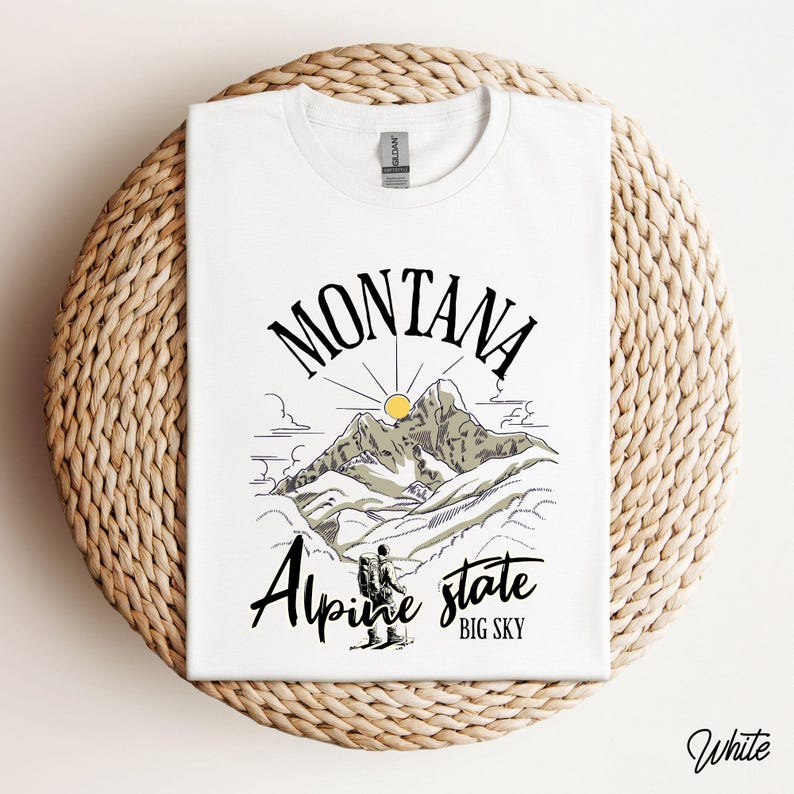 Folded Gildan 64000 Montana hiking tee with nature-inspired graphic, soft cotton fabric