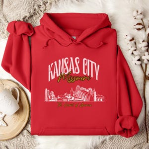 Retro oversized Kansas City skyline Hoodie with vintage cityscape design. Unisex hooded sweatshirt perfect for Kansas City fans and Missouri State lovers. Unique varsity-style Kansas City fan shirt with bold city skyline graphic.
