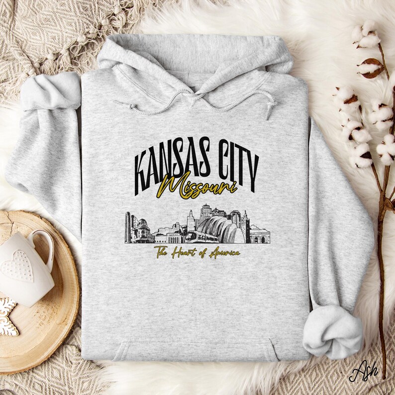 Retro oversized Kansas City skyline Hoodie with vintage cityscape design. Unisex hooded sweatshirt perfect for Kansas City fans and Missouri State lovers. Unique varsity-style Kansas City fan shirt with bold city skyline graphic.