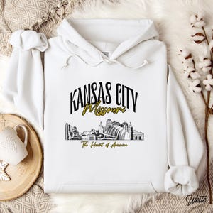 Retro oversized Kansas City skyline Hoodie with vintage cityscape design. Unisex hooded sweatshirt perfect for Kansas City fans and Missouri State lovers. Unique varsity-style Kansas City fan shirt with bold city skyline graphic.