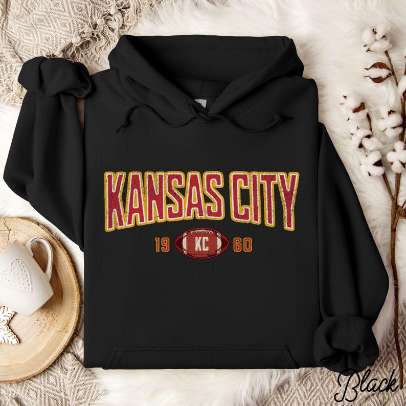 Varsity-style Chiefs hoodie for Kansas City football fans. Perfect for tailgates, Sunday football, or everyday wear. A cozy sweatshirt designed for football fanatics, showcasing Chiefs fandom and making a great fan gift.