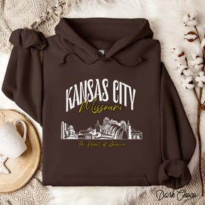 Retro oversized Kansas City skyline Hoodie with vintage cityscape design. Unisex hooded sweatshirt perfect for Kansas City fans and Missouri State lovers. Unique varsity-style Kansas City fan shirt with bold city skyline graphic.