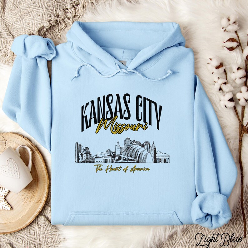 Retro oversized Kansas City skyline Hoodie with vintage cityscape design. Unisex hooded sweatshirt perfect for Kansas City fans and Missouri State lovers. Unique varsity-style Kansas City fan shirt with bold city skyline graphic.