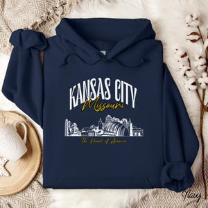 Retro oversized Kansas City skyline Hoodie with vintage cityscape design. Unisex hooded sweatshirt perfect for Kansas City fans and Missouri State lovers. Unique varsity-style Kansas City fan shirt with bold city skyline graphic.