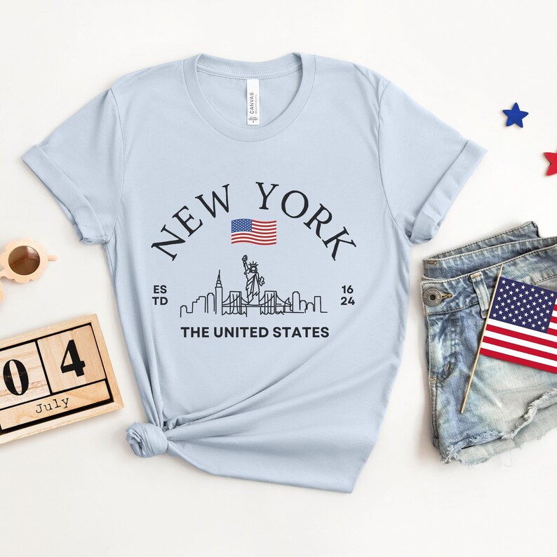 New York Skyline T-Shirt, US Flag Shirt, NYC Skyline Tee, Patriotic NYC Shirt, American Flag Apparel, NYC Skyline Graphic Tee, Statue of Liberty Shirt, NYC Landscape Shirt, Empire State Shirt, NYC Flag Tee, New York City Graphic Tee,